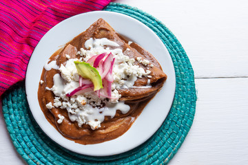 Mexican tacos with beans sauce and fresh cheese also called 