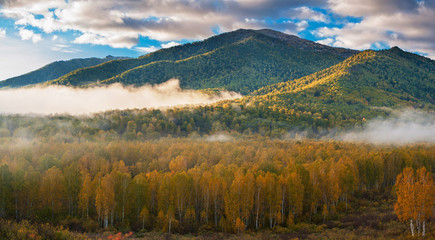 Fototapeta na wymiar Panoramic picture of sunrise in Altai mountains nature reserve. The beginning of autumn, September