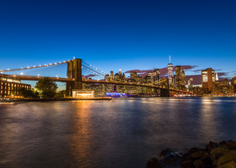 Fototapeta na wymiar New York City skyline buildings evening Brooklyn Bridge