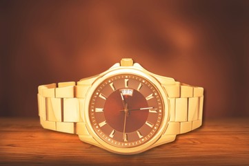 Me's gold mechanical watch abstract background