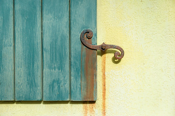 Wooden Door with Metal Handle on a Stone Wall