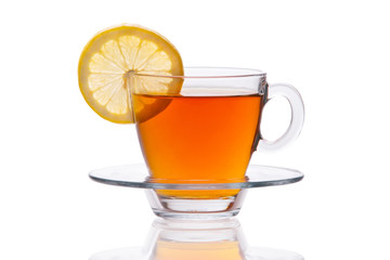 Glass cup of black tea with lemon slice isolated on white background