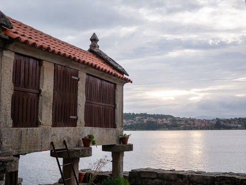 beautiful view of a traditional granary or horreo by the sea in the fishing village of Combarro, Spain