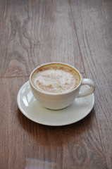 cup of coffee on wooden table