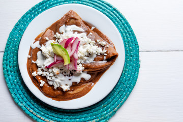 Mexican tacos with beans sauce and fresh cheese also called 