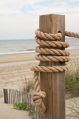 Pole and Rope by the sandy shore