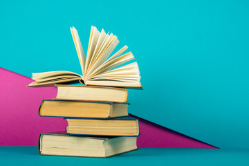 Open book, hardback books on wooden table. Back to school. Copy space