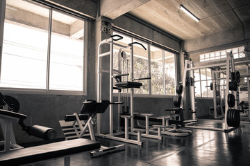 Within gym with modern fitness equipment.