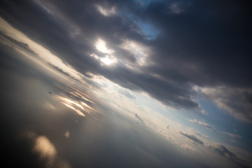 Dramatic sky with clouds and sun on sunrise. Nature abstract composition