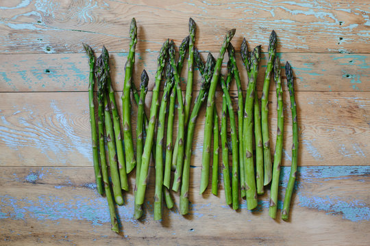 Bunch of fresh picked asparagus on rustic farm table