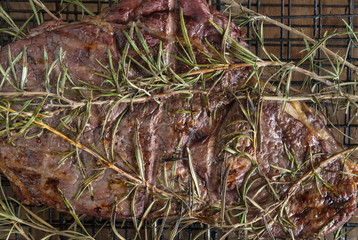 Beef steak grilled with rosemary on the barbecue