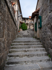 narrow street with stone stairs in old town in Combarro, Pontevedra, Spain