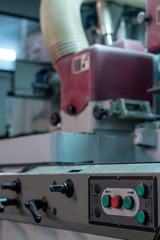 At sawmill. Close-up of machine with control panel