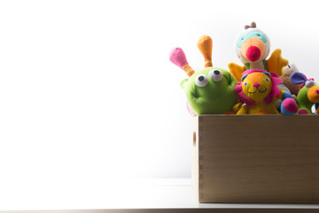Toys collection in box isolated on white background. Donatation. Copy space for text