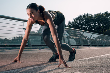 Confident runner at the start looking away stock photo