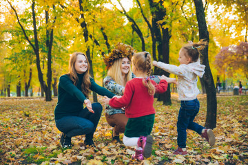 family playing at city park mothers with daughters