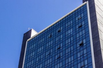 Perspective shoot of high-rise glazing facade office building top