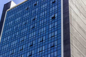 Fototapeta na wymiar Perspective shoot of high-rise glazing facade office building structure