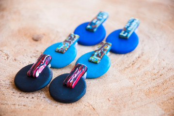 Three pairs of handmade colorful stud earrings.