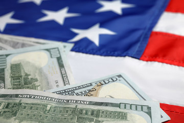 Pile of dollars on national USA flag