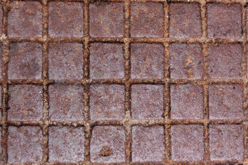 rusty metal surface with a pattern of squares