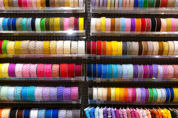 Yarn thread spool row beauty fashion textile on shelf in supermarket for DIY handmade workshop textured background
