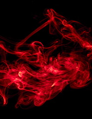 Red smoke on black background