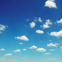 Fluffy clouds in the blue sky.