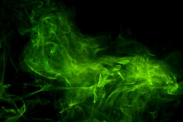 Obraz na płótnie Canvas Green smoke on black background