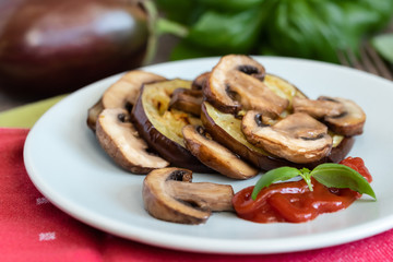 Grilled eggplant slices layered with mushrooms.