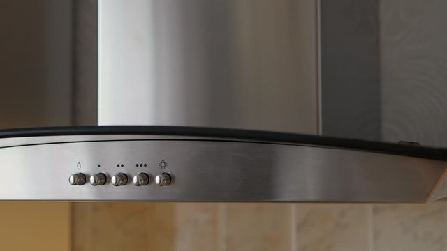 The Man Pressed Button On Panel Contemporary Kitchen Hood.