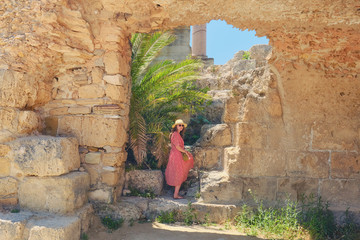 Woman tourist in the arch among the ruins of Anthony terms. Carthage excavations from Hannibal's wars with Rome. Tunisia 18 06 2019