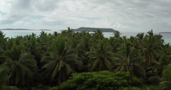 Aerial view of a scenic landscape of desert island with white sand beach and crystal clear sea water bay.