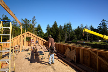 Fototapeta na wymiar New home construction process, skilled roofer 