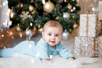 Fototapeta na wymiar Cute baby on floor at Christmas tree
