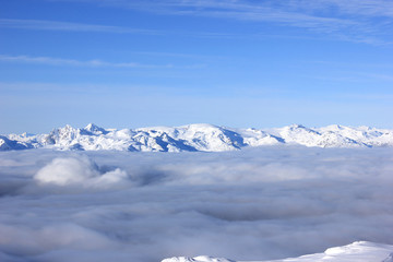 Fototapeta na wymiar snow-covered mountains over the fog in canada