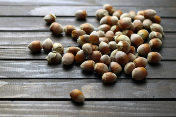 Ripe hazelnuts on wooden background