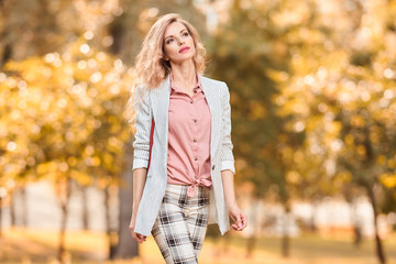 Fall Fashion Outdoor. Woman in park, Autumn outfit