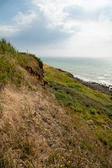 Fototapeta na wymiar coastline with cliff and blue sky 