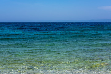 Fototapeta na wymiar Clear blue Adriatic see water on sunny summer day, Korcula Island, Damatia, Croatia, nice background image