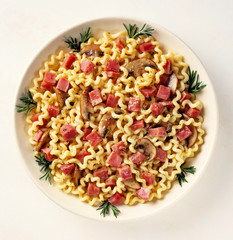 Ham & Mushroom Pasta in bowl against white