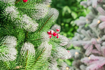 Christmas and New Year holidays background. Christmas tree decorated false snow  and garlands. Glittering and sparkling. Celebration concept