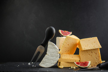 cheese, different types (variety of raw, snack and figs) menu concept. food background. copy space. Top view