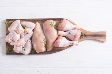 Raw chicken meat on wooden background © whitestorm