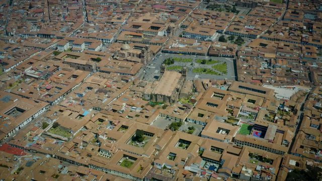 Aerial view from above of Main Square (Plaza de Armas) where is located the Cathedral and Jesuit Church (church of the Society of Jesus), Cusco, Peru