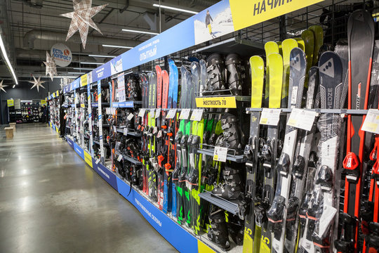 ST. PETERSBURG, RUSSIA-CIRCA DEC, 2018: Mountain ski and snowboard equipments, winter sport goods are on sale in Decathlon Russian store. Decathlon is a French sporting goods retailer