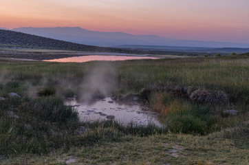 Alkali Lake and vapor rising over Shepherd Hot Springs in Long Valley at sunrise (Whitmore Hot Springs, Mono County, California)