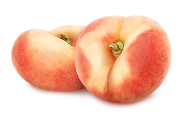 Composition with juicy flat peaches isolated on white background.