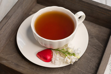 composition with a Cup of tea and lilac