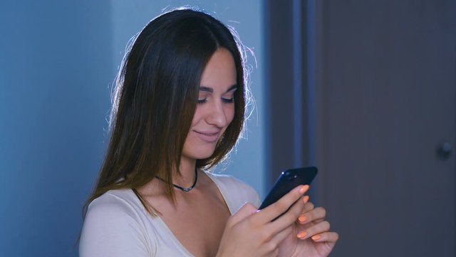 Woman use of mobile phone on at night